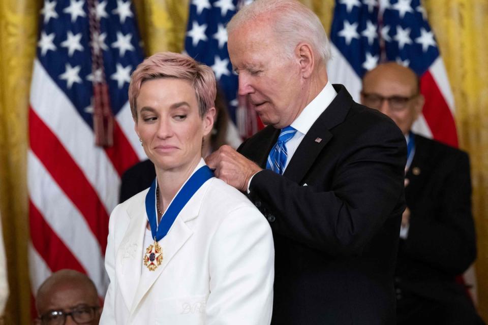 US President Joe Biden presents Megan Rapinoe with the Presidential Medal of Freedom (AFP via Getty Images)