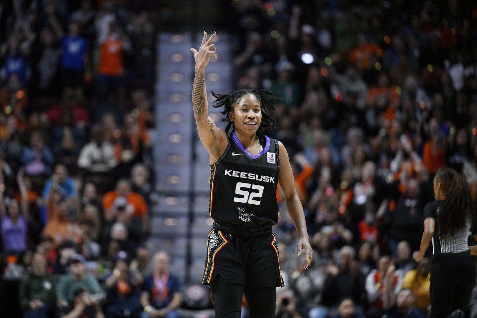 Connecticut Sun guard Tyasha Harris reacts after making a three-point basket during the second half of Game 4 in the WNBA basketball semifinals against the Minnesota Lynx, Sunday, Oct. 6, 2024, in Uncasville, Conn. (AP Photo/Jessica Hill)