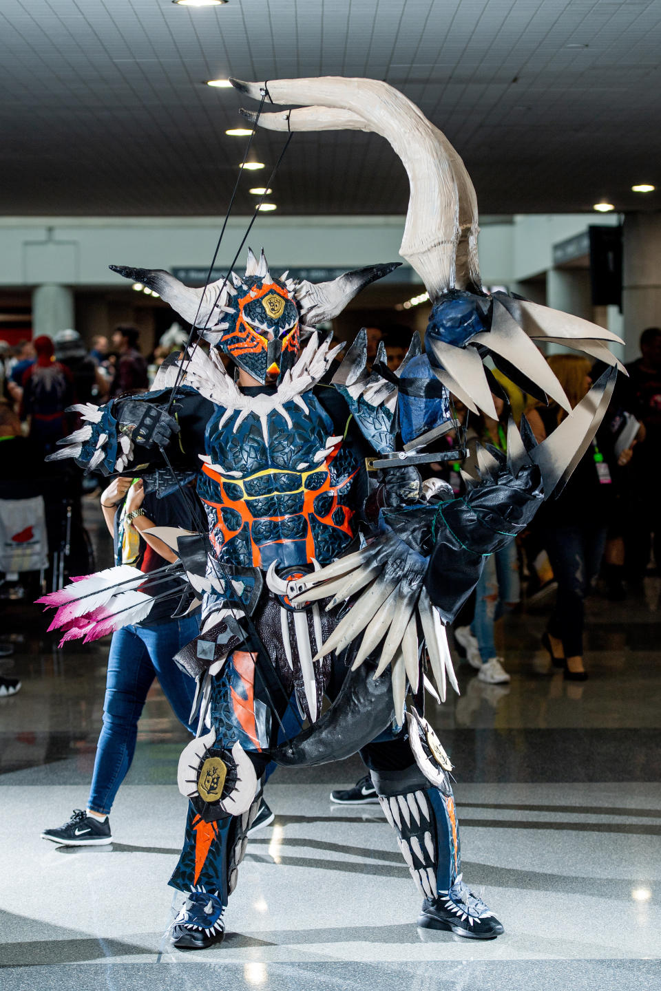A cosplayer poses in elaborate costume.