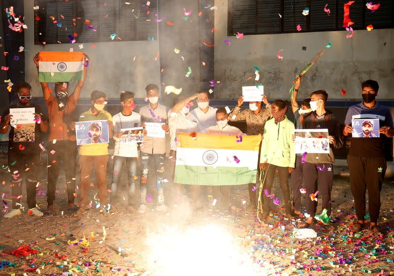 Indian cricket fans celebrate the victory in Ahmedabad