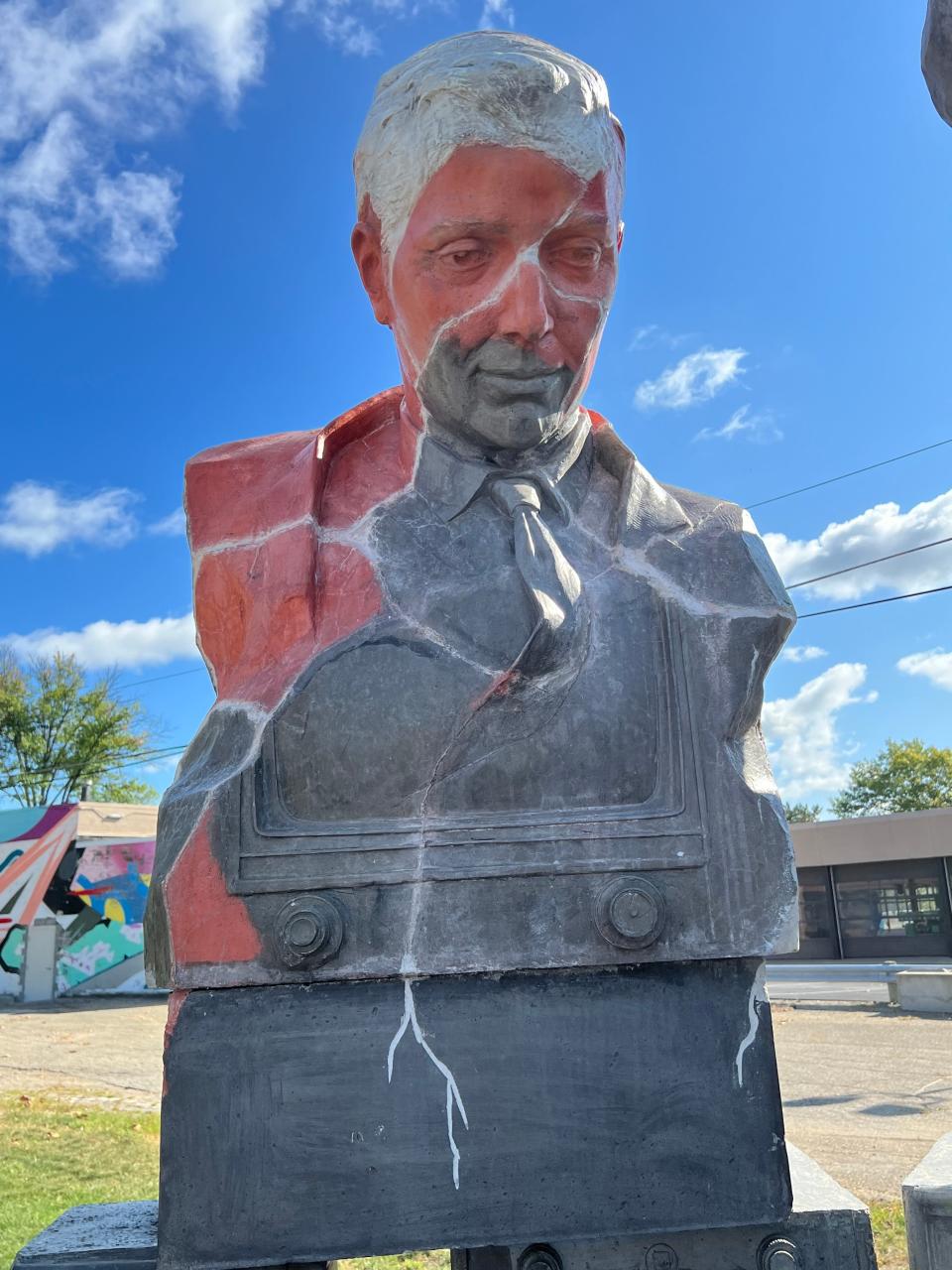 This sculpture, part of a public art display commemorating a historic moment in NFL football, is at the site of a pocket park project in downtown Canton being headed by ArtsinStark. In the background is the former Ziegler Tire Building, the proposed future site of the EN-RICH-MENT Fine Arts Academy.