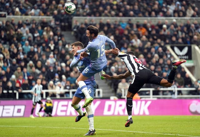 Bournemouth defender Adam Smith (centre) heads into his own net to hand Newcastle victory