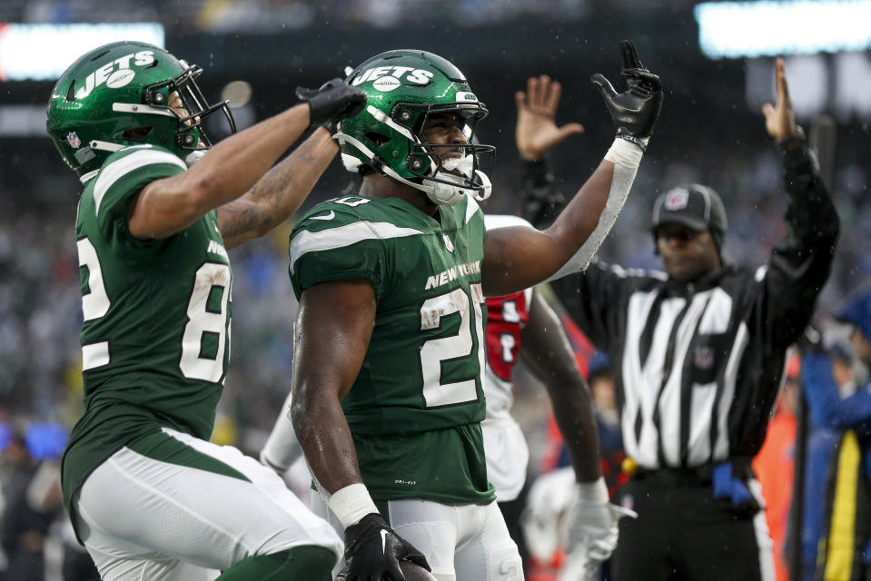 New York Jets running back Breece Hall (20) celebrates with wide receiver Xavier Gipson (82) after scoring a touchdown against the Houston Texans during the fourth quarter of an NFL football game, Sunday, Dec. 10, 2023, in East Rutherford, N.J. (AP Photo/John Munson)