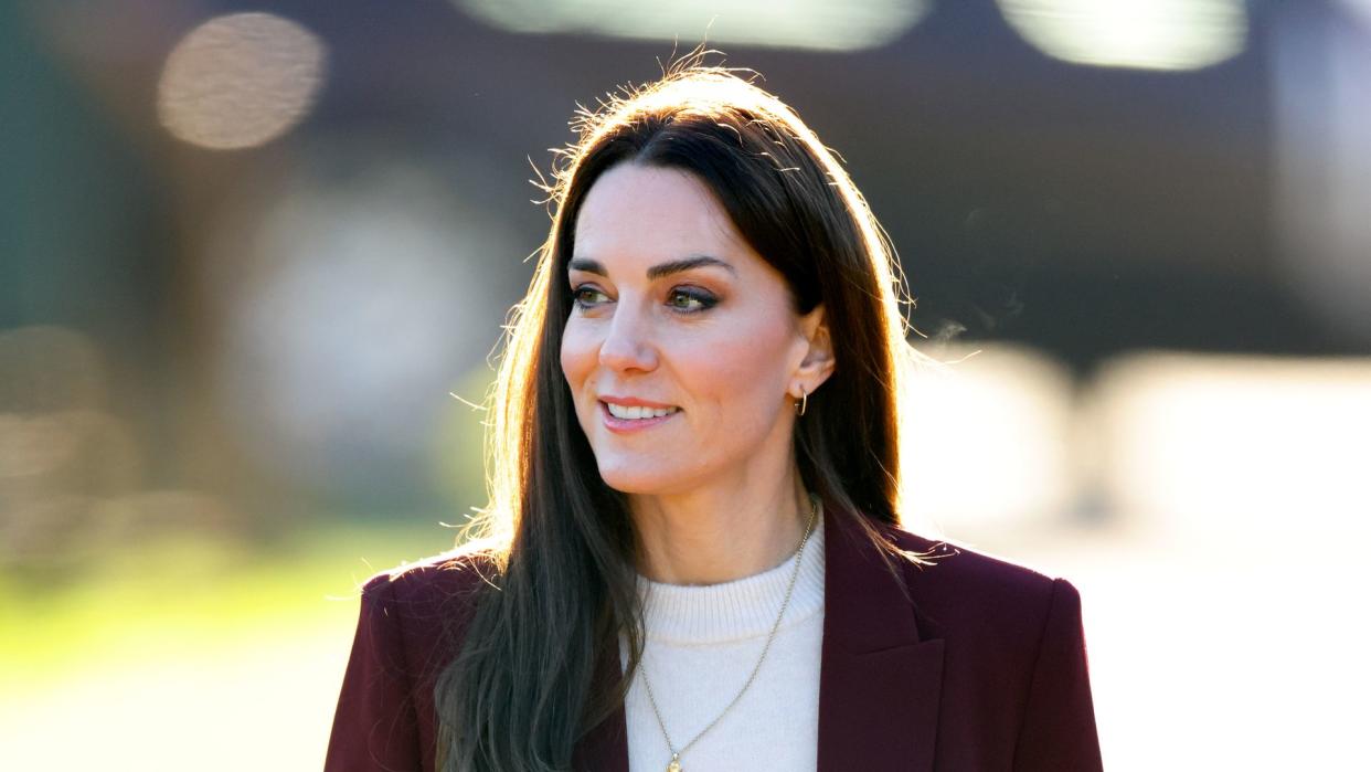 Kate Middleton wearing burgundy suit