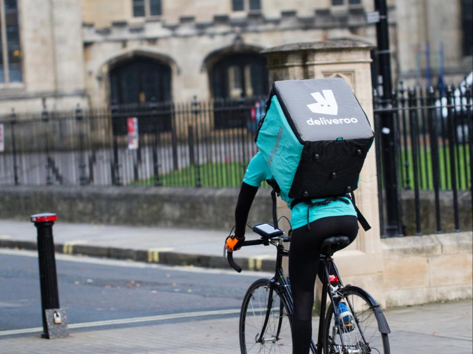 A Deliveroo rider on a bicycle (Getty Images)