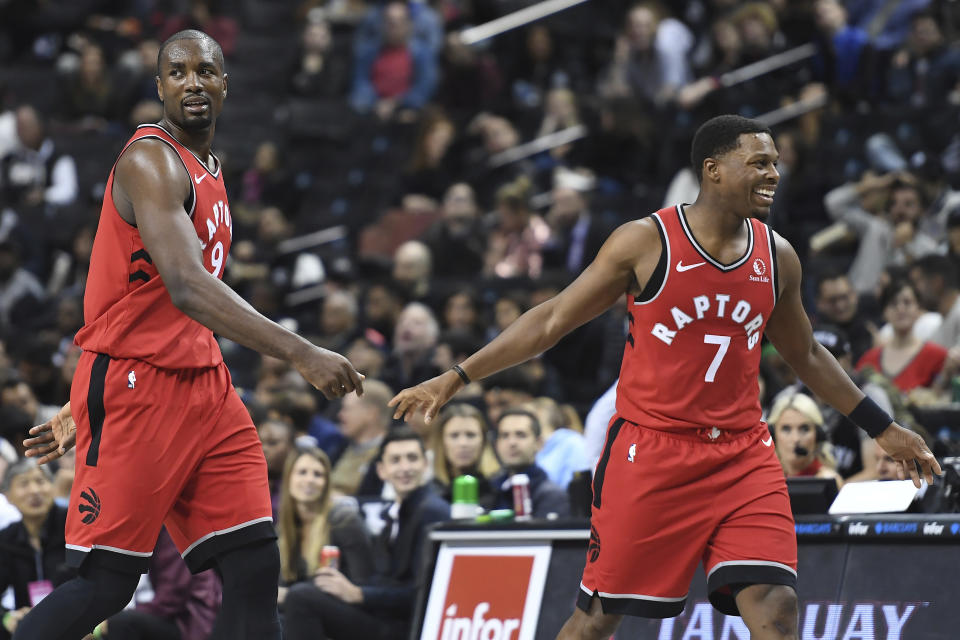 Toronto Raptors guard Kyle Lowry (7) and forward Serge Ibaka (9) react during the fourth quarter of a preseason NBA basketball game against the Brooklyn Nets Friday, Oct. 18, 2019, in New York. (AP Photo/Sarah Stier)