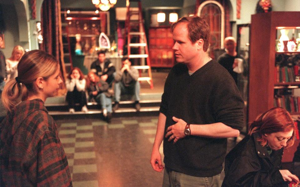 Whedon with Sarah Michelle Gellar on the set of Buffy the Vampire - Los Angeles Times