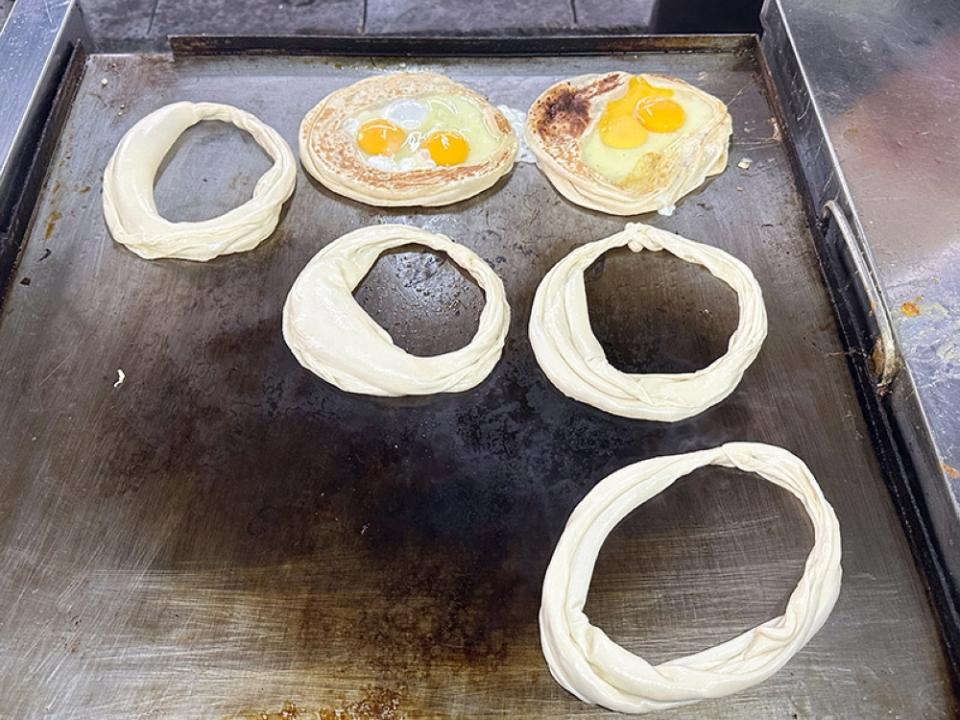 Start making the side of the 'nest' with a circle of dough, which will be filled with two eggs and later sardine curry