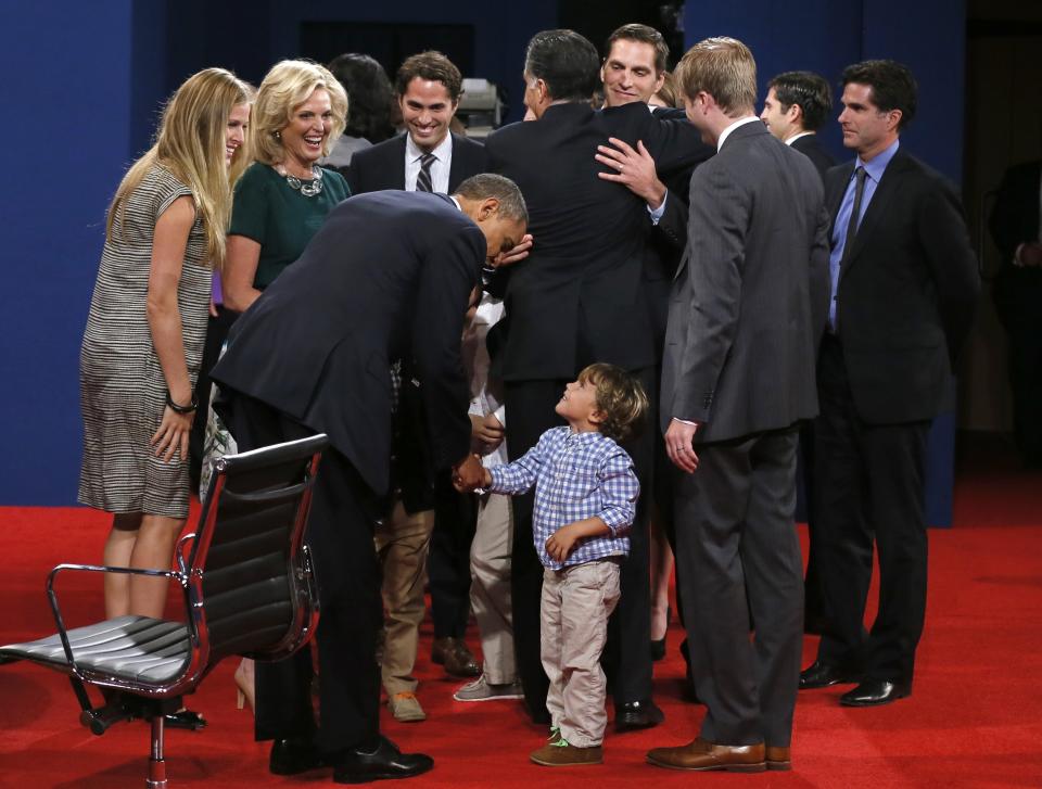 President Barack Obama greets members of the family of Republican presidential nominee Mitt Romney after the third presidential debate at Lynn University, Monday, Oct. 22, 2012, in Boca Raton, Fla. (AP Photo/Pool-Rick Wilking)