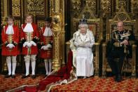 Queen Elizabeth II (L) reads the Queen's Speech next to Prince Philip, Duke of Edinburgh, in the Chamber of the House of Lords during the State Opening of Parliament in the Palace of Westminster in London on May, 9, 2012