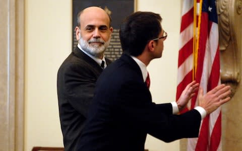 Ben Bernanke, left, with Randy Krozner - Credit: CAROL T. POWERS/Bloomberg News