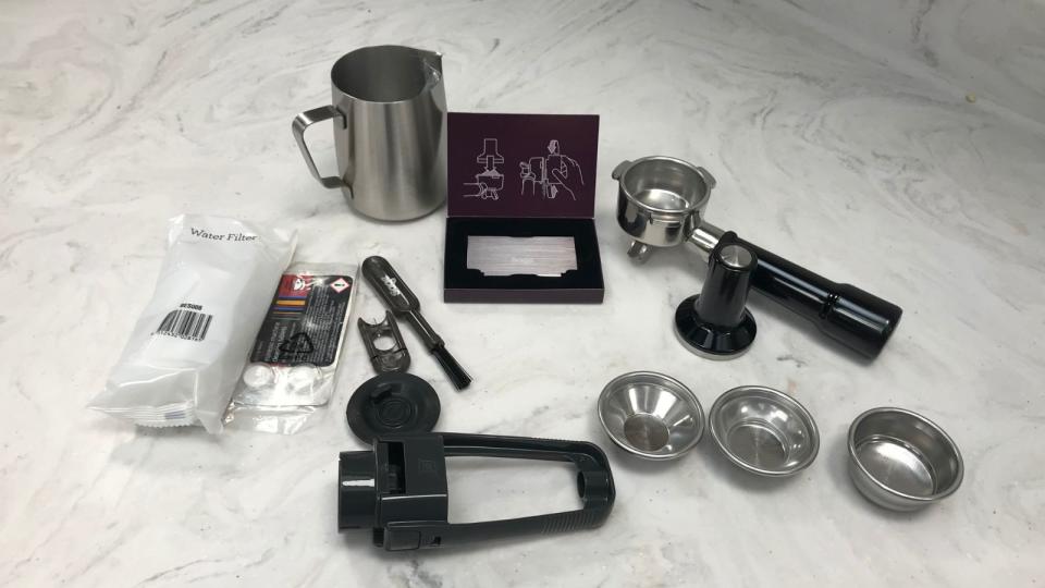 Breville Barista Pro accessories on a marble countertop