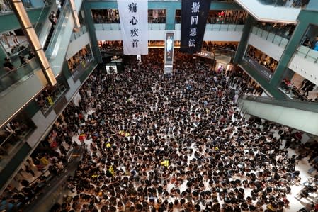 Demonstrators attend a rally to support the city-wide strike and to call for democratic reforms at New Town Plaza shopping mall in Hong Kong