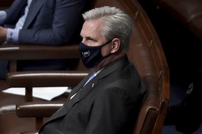 House Minority Leader Kevin McCarthy, R-Calif., looks on in the House Chamber after they reconvened for arguments over the objection of certifying Arizona’s Electoral College votes in November’s election, at the Capitol in Washington, Wednesday, Jan. 6, 2021. (Greg Nash/Pool via AP)