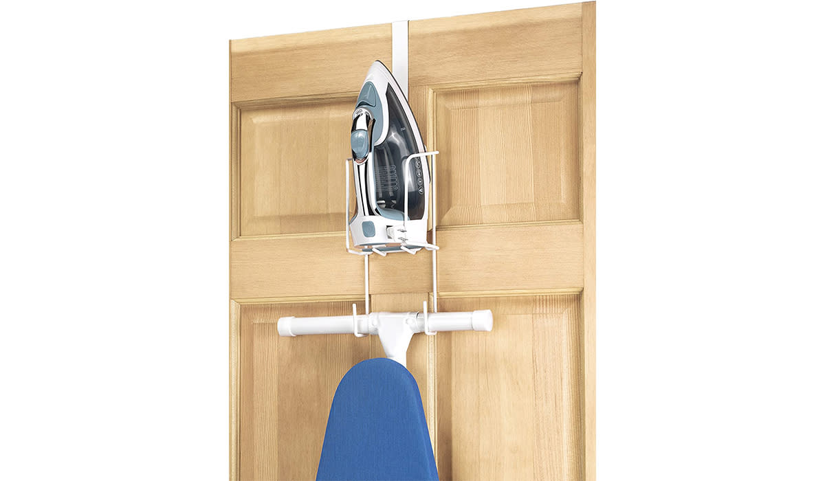 Door shown with over-the-door organizer holding an iron and ironing board