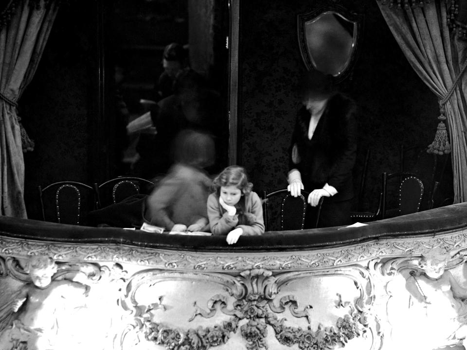 A young Queen Elizabeth at a theater in 1935.