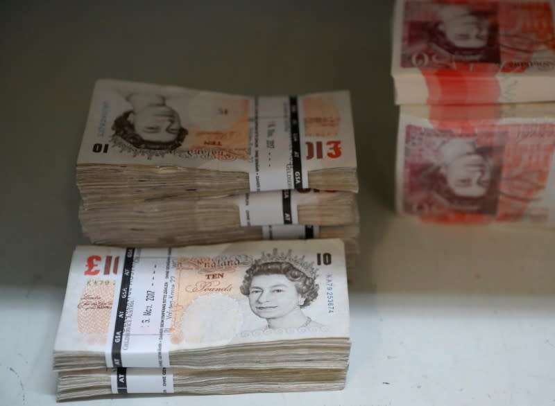 Wads of British Pound Sterling banknotes are stacked in piles at the Money Service Austria company's headquarters in Vienna, Austria, November 16, 2017. REUTERS/Leonhard Foeger/Files