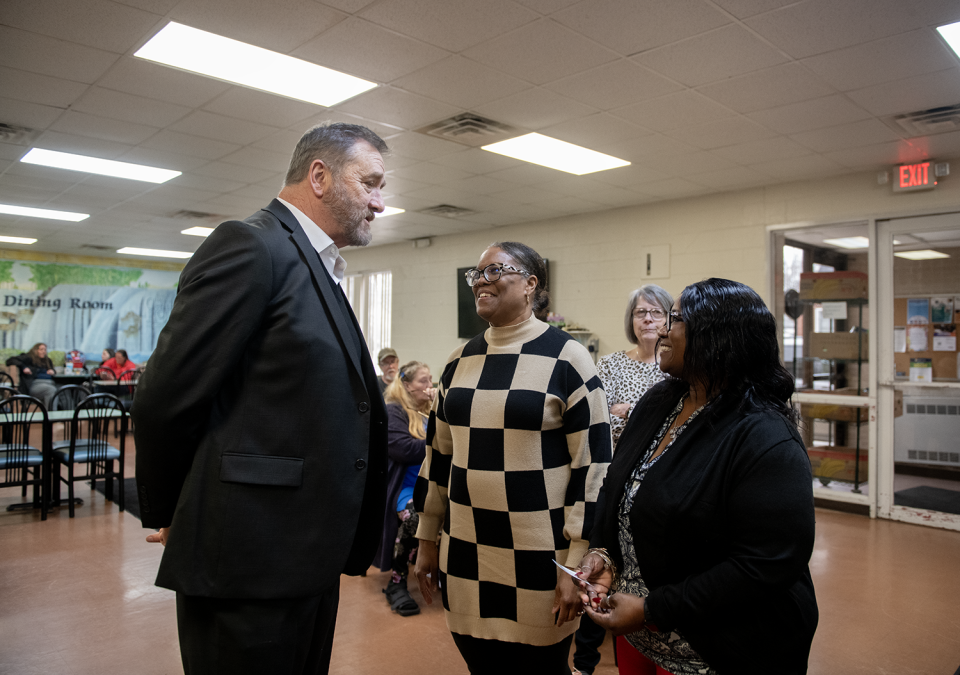 Ohio Attorney General Dave Yost speaks with LaJoyce Harris, program manager of the Center of Hope, and Marquice Seward, Kent Social Services program director, during a visit Thursday, March 7, 2024, to Center of Hope in Ravenna.