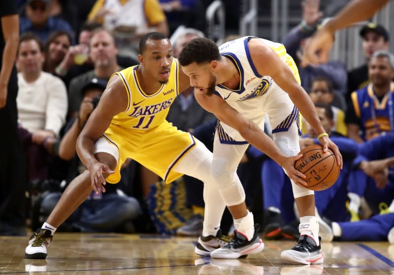 SAN FRANCISCO, CALIFORNIA - OCTOBER 05: Stephen Curry #30 of the Golden State Warriors is guarded by Avery Bradley #11 of the Los Angeles Lakers at Chase Center on October 05, 2019 in San Francisco, California. NOTE TO USER: User expressly acknowledges and agrees that, by downloading and or using this photograph, User is consenting to the terms and conditions of the Getty Images License Agreement. (Photo by Ezra Shaw/Getty Images)