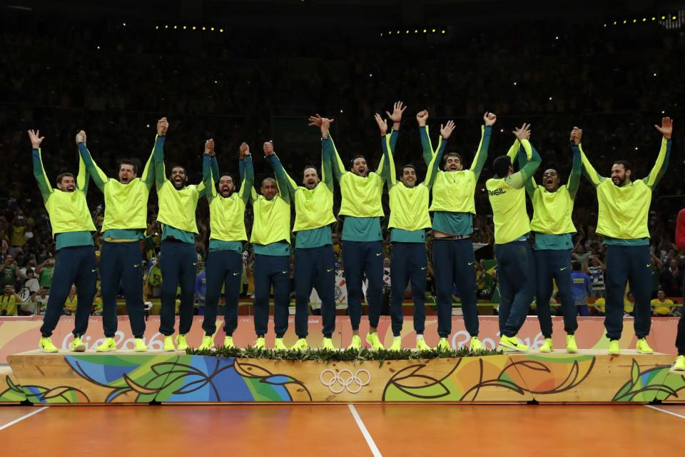 <p>Members of Brazil’s team take the stand to receive their gold medals during an awarding ceremony for men’s volleyball at the 2016 Summer Olympics in Rio de Janeiro, Brazil, Sunday, Aug. 21, 2016. (AP) </p>