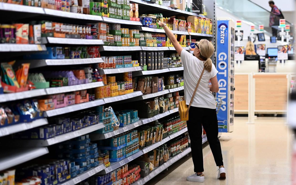 A customer shops at a supermarket in London, Britain, 20 July 2022. - ANDY RAIN/EPA-EFE/Shutterstock/Shutterstock