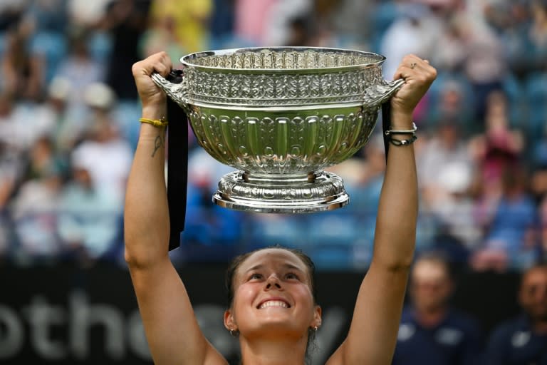 Champion's joy: Russia's Daria Kasatkina lifts the trophy after defeating <a class="link " href="https://sports.yahoo.com/soccer/teams/canada-women/" data-i13n="sec:content-canvas;subsec:anchor_text;elm:context_link" data-ylk="slk:Canada;sec:content-canvas;subsec:anchor_text;elm:context_link;itc:0">Canada</a>'s Leylah Fernandez in the final of the Eastbourne International WTA Tour event (Glyn KIRK)
