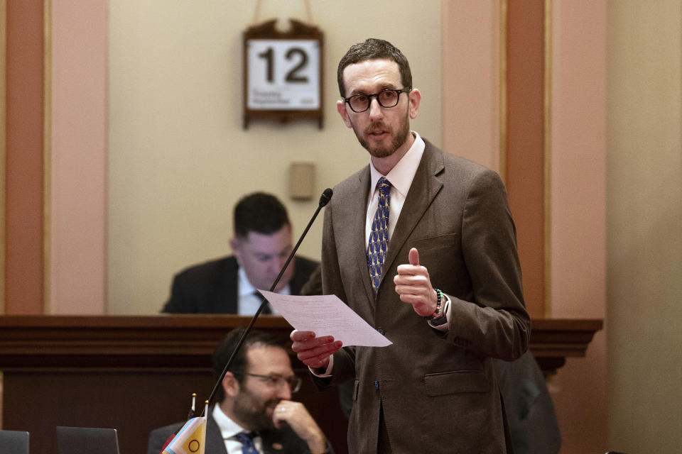 State Sen. Scott Wiener, D-San Francisco, calls for passage of his climate bill during the Senate session at the Capitol in Sacramento, Calif., Tuesday, Sept. 12, 2023. The measure, SB253, requires big companies to disclose a sweeping range of greenhouse gas emissions. Lawmakers are voting on hundreds of bills before the legislative session concludes for the year on Thursday. (AP Photo/Rich Pedroncelli)