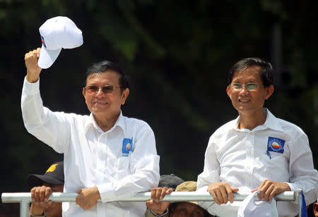 Kem Sokha (L), President of the Cambodia National Rescue Party (CNRP), gestures during a local election campaign in Phnom Penh, Cambodia May 20, 2017. REUTERS/Samrang Pring