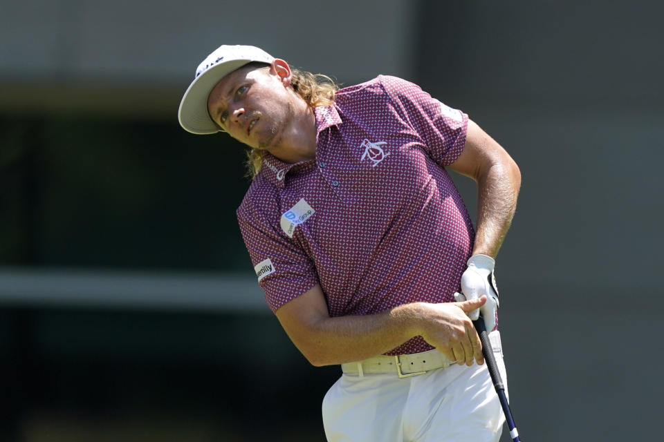 Cameron Smith, of Australia, watches his shot on the sixth tee during the final round of the St. Jude Championship golf tournament, Sunday, Aug. 14, 2022, in Memphis, Tenn. (AP Photo/Mark Humphrey)