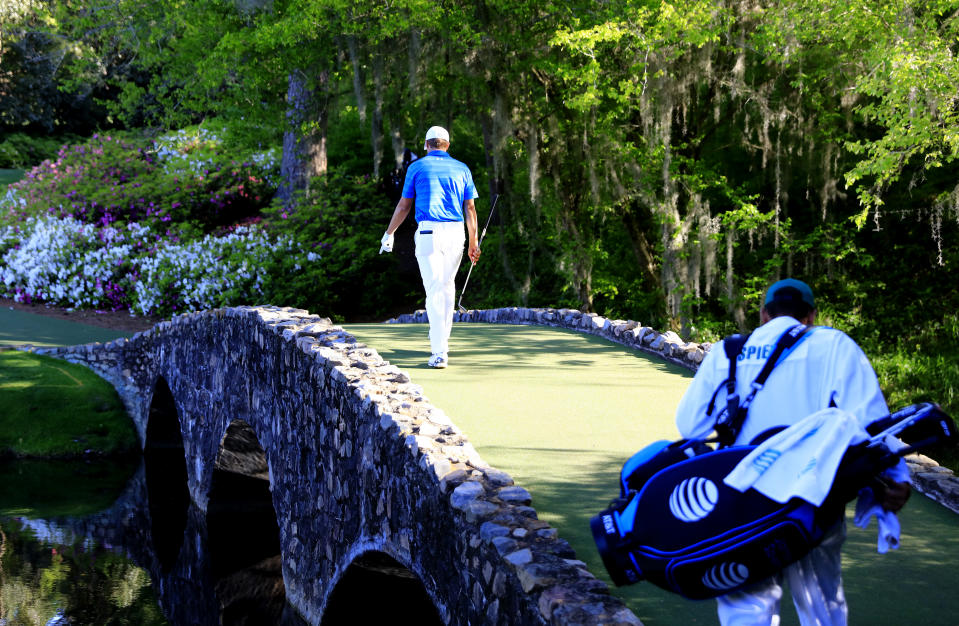 Jordan Spieth with a lonely walk across Nelson Bridge in 2016. (Rob Brown/Augusta National via Getty Images)