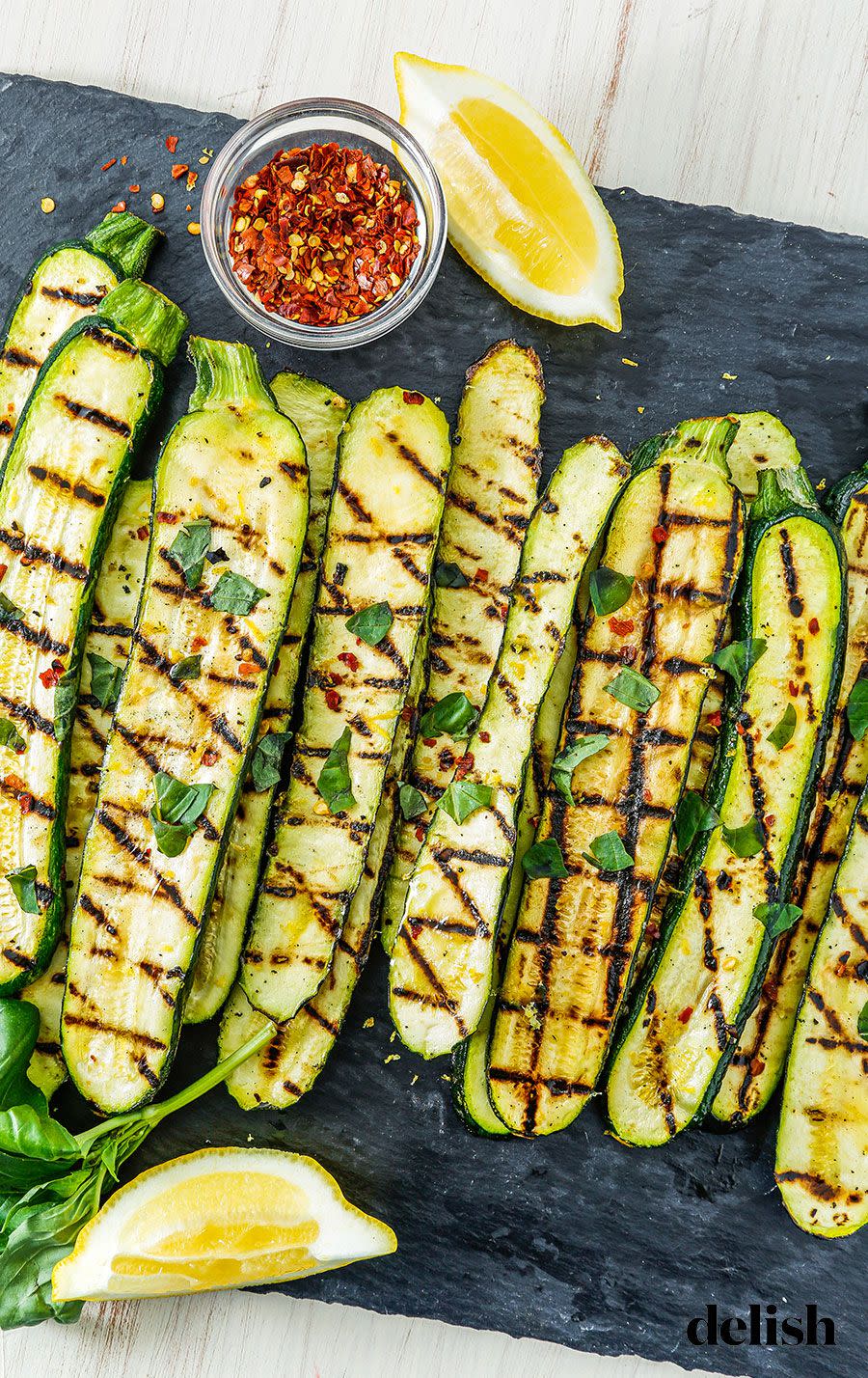 <p>Here's your healthy, go-to summer side.</p><p>Get the recipe from <a href="https://www.delish.com/cooking/recipe-ideas/recipes/a53484/grilled-zucchini-recipe/" rel="nofollow noopener" target="_blank" data-ylk="slk:Delish;elm:context_link;itc:0;sec:content-canvas" class="link ">Delish</a>.</p>