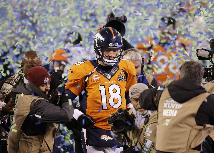 Denver Broncos quarterback Peyton Manning walks off the field after the Broncos lost to the Seattle Seahawks in the NFL Super Bowl XLVIII football game Sunday, Feb. 2, 2014, in East Rutherford, N.J. The Seahawks won 43-8. (AP Photo/Chris O'Meara)