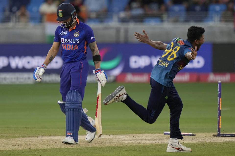 Sri Lanka's Dilshan Madushanka, right, celebrates the dismissal of India's Virat Kohli, left, during the T20 cricket match of Asia Cup between Sri Lanka and India, in Dubai, United Arab Emirates, Tuesday, Sept. 6, 2022. (AP Photo/Anjum Naveed)