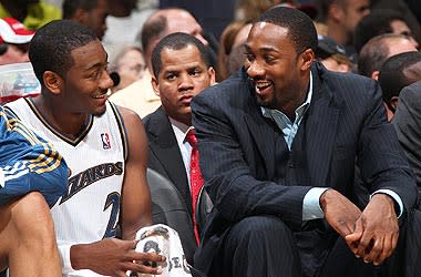 Gilbert Arenas (right) says he has no problem turning over the Wizards' reins to rookie John Wall. "I know my time here is over," Arenas says