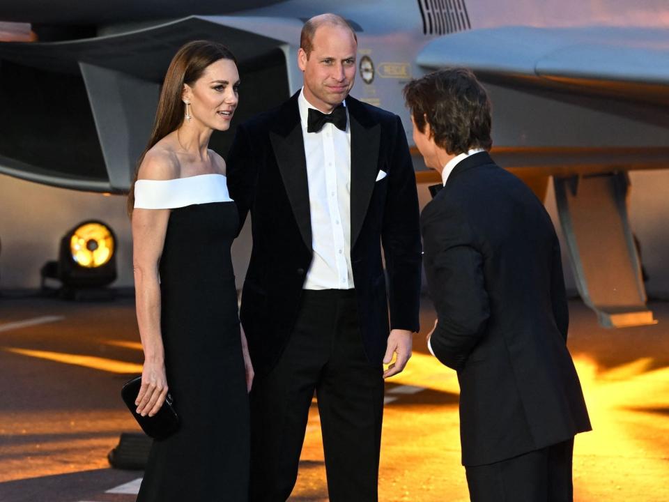 The Duke and Duchess of Cambridge speak with Tom Cruise on May 19, 2022.