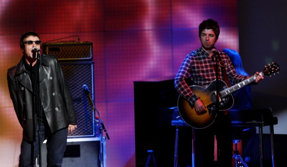 Noel and Liam on stage in 2008, one year before Oasis split (Getty Images)
