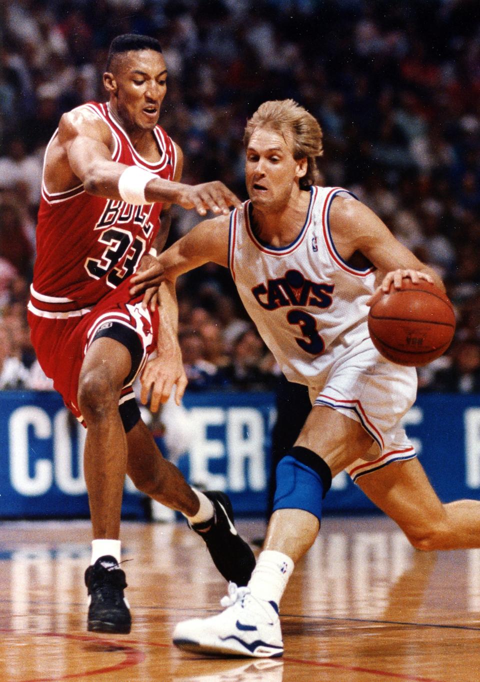 The Cleveland Cavaliers' Craig Ehlo, right, drives to the basket against the Chicago Bulls' Scottie Pippen at the Richfield Coliseum on May 25, 1992, in Richfield, Ohio.