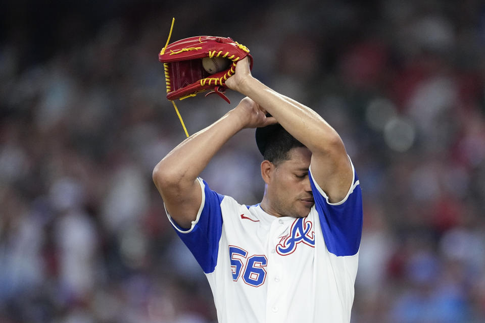 Atlanta Braves pitcher Yonny Chirinos wipes his face during the fourth inning of the team's baseball game against the San Francisco Giants on Saturday, Aug. 19, 2023, in Atlanta. (AP Photo/John Bazemore)