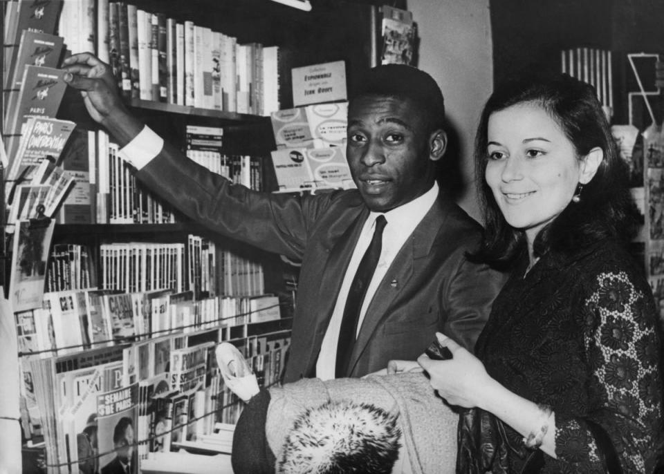 Pele and his wife Rosemeri dos Reis Cholbi shopping in Paris where they were honeymooning, 17th March 1966. (Getty Images)