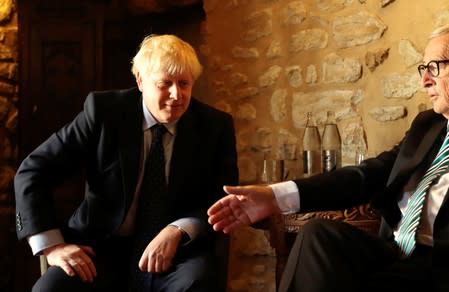 EC President Juncker shakes hands with British PM Johnson in Luxembourg