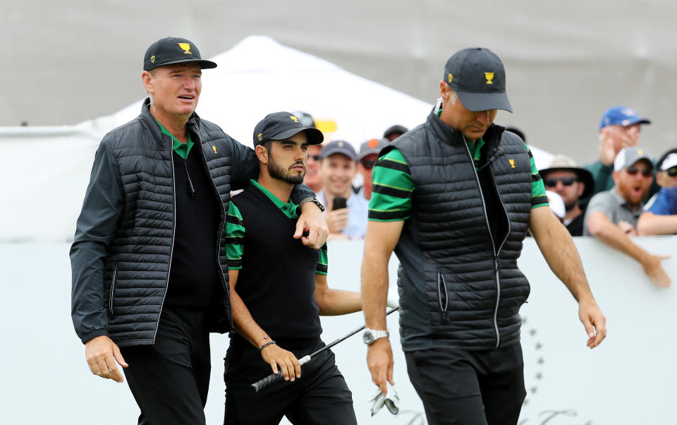 Ernie Els walks off with Abraham Ancer and co-captain Trevor Immelman. (Photo by Warren Little/Getty Images)