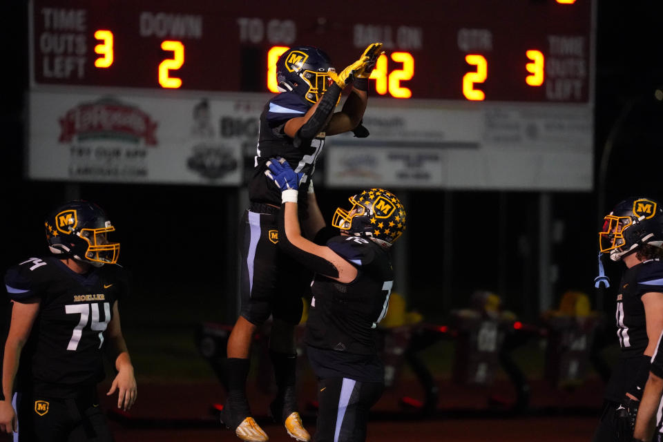 Moeller celebrates after scoring during an OHSAA playoff game Friday, Nov. 4, 2022, at Norwood High School.