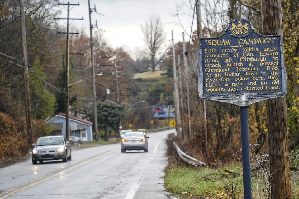 In this photo from Thursday, Nov. 18, 2021, a Pennsylvania Historical and Museum Commission plaque is seen along a roadside in New Castle, Pa. A recent review of all 2,500 markers the Pennsylvania Historical and Museum Commission had been installing for more than a century, faced a fresh round of questions about just whose stories were being told on the state's roadsides, and the language used to tell them. The increased scrutiny that has focused on factual errors, inadequate historical context and racist or otherwise inappropriate references, prompting the state to remove two markers, revise two and order new text for two others so far. The changes have become grist for the political mill. (AP Photo/Keith Srakocic)