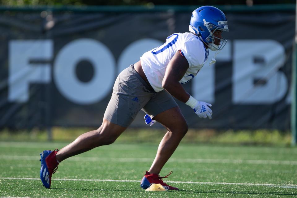 Kansas senior linebacker Rich Miller (30) runs through drills during a fall camp practice this year. Miller is key to what the Jayhawks are looking to do on the defensive side of the ball.