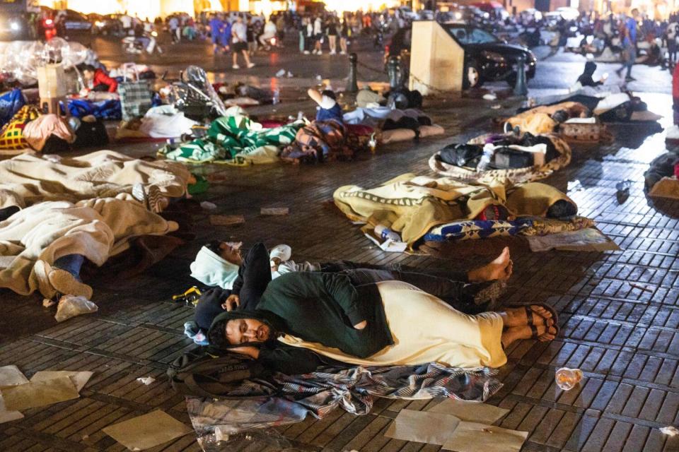 Residents take shelter ouside at a square following an earthquake in Marrakesh on