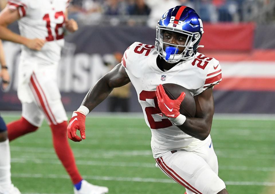 Aug 11, 2022; Foxborough, Massachusetts, USA; New York Giants running back Jashaun Corbin (25) runs after a catch during the second half of a preseason game against the New England Patriots at Gillette Stadium. Mandatory Credit: Eric Canha-USA TODAY Sports