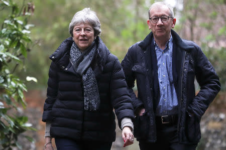 Britain's Prime Minister Theresa May and her husband Philip arrive at church, in Sonning, Britain, March 31, 2019. REUTERS/Simon Dawson