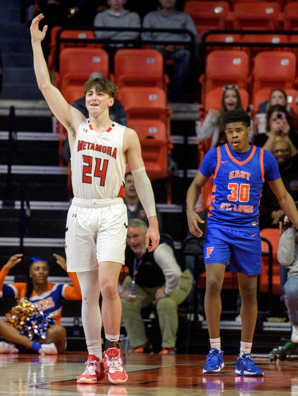 Metamora's Drew Tucker (24) celebrates as time runs out on the Class 3A state semifinal game Friday, March 10, 2023 at State Farm Center in Champaign. The Redbirds advanced to the title game with a 50-43 win over East St. Louis.