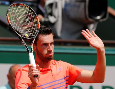 Quentin Halys of France reacts during the men's singles match against Rafael Nadal of Spain at the French Open tennis tournament at the Roland Garros stadium in Paris, France, May 26, 2015. REUTERS/Pascal Rossignol