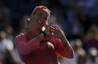 Victoria Azarenka of Belarus makes a heart symbol as she celebrates defeating Flavia Pennetta of Italy at the U.S. Open tennis championships in New York September 6, 2013. REUTERS/Eduardo Munoz